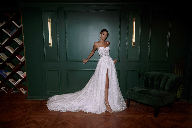 white wedding dress in a dark room